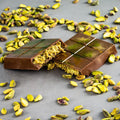 Milk chocolate pistachio kunnafa bar .