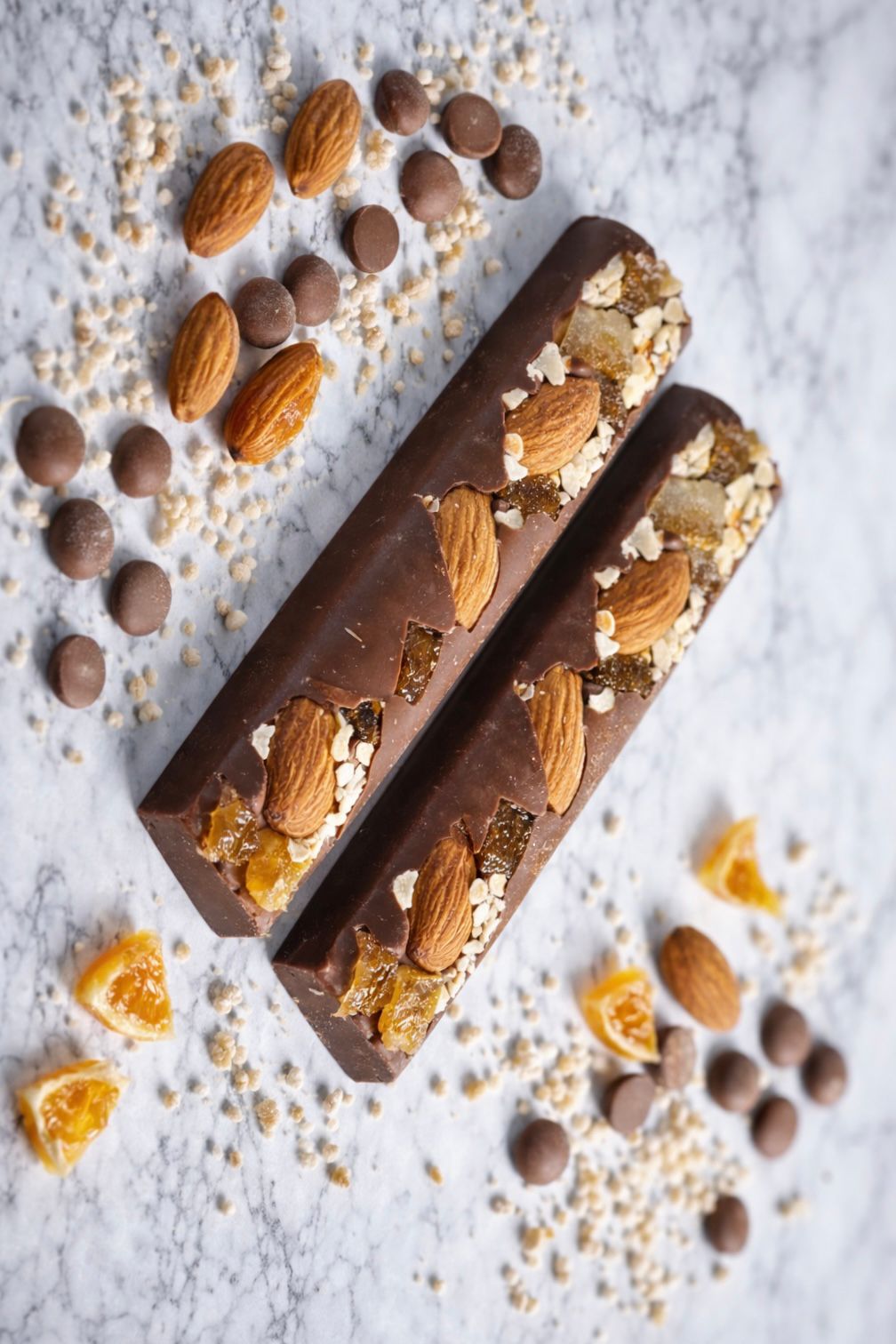 Milk chocolate bar with with nuts and orane zest.
